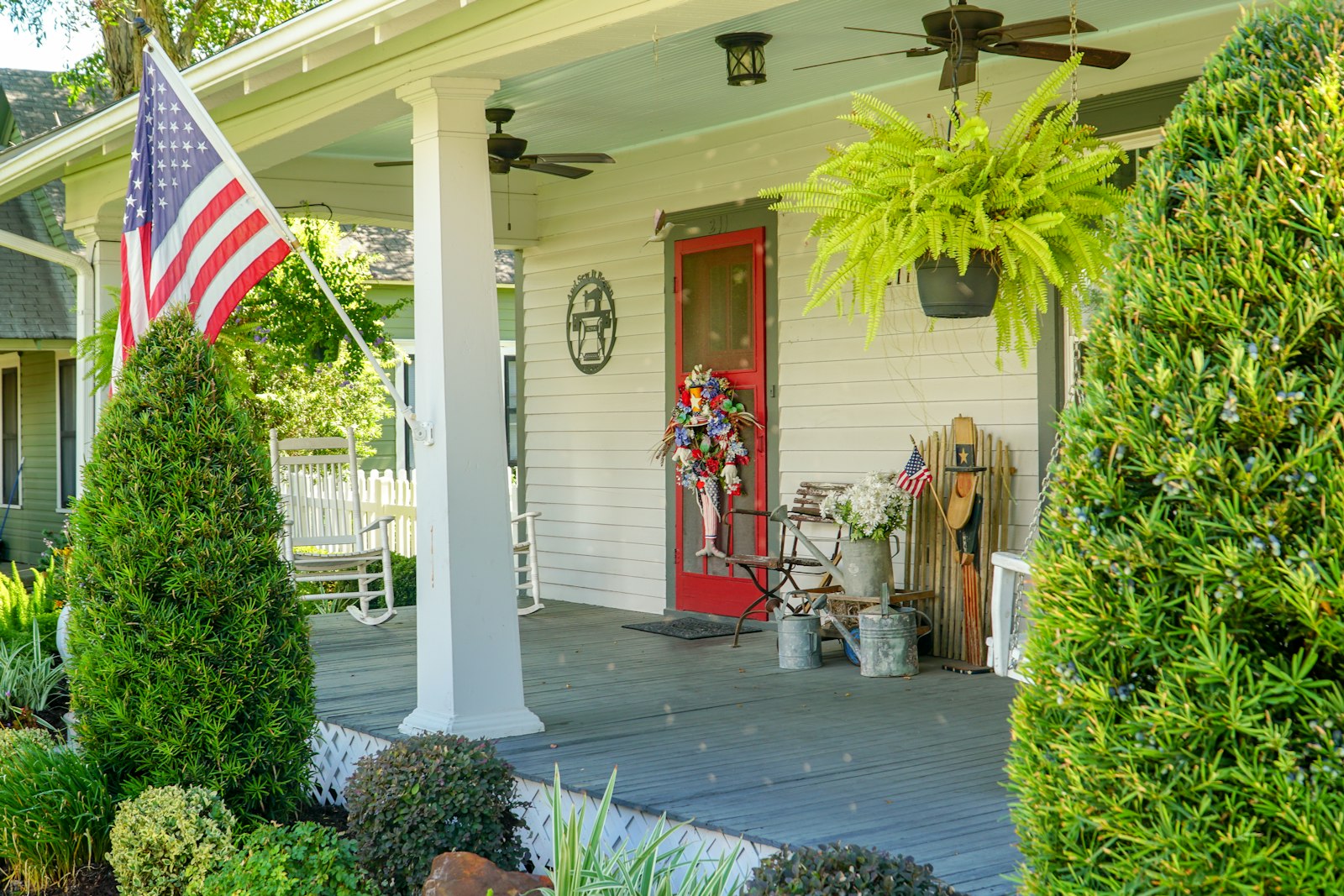 A porch with a flag on the front